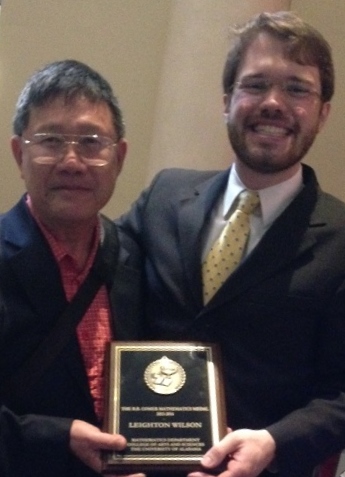 Hsia and Wilson holding award