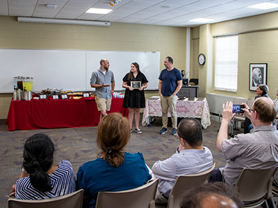 graduate student accepting an award